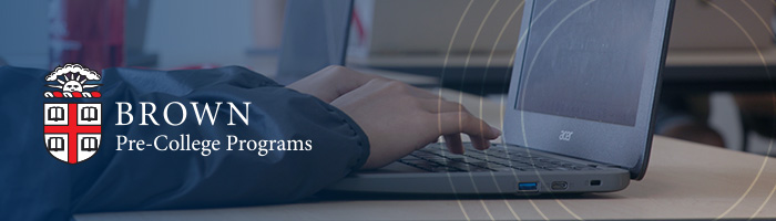 Brown Pre-College logo overlaid on a photo of a laptop on a desk being used by a student.